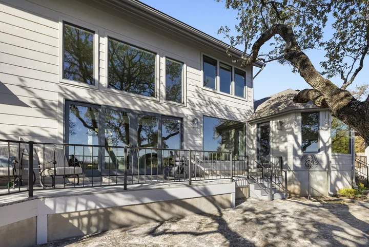 Completed replacement windows and doors across the deck side of a Georgetown, Texas home