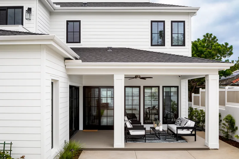 Dark-framed replacement windows and sliding doors on a Georgetown, Texas home
