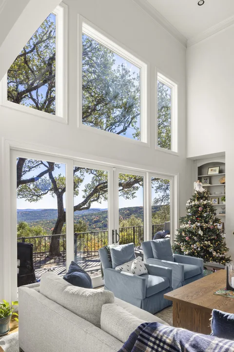 Tall replacement windows and patio doors filling a bright Georgetown, Texas living room